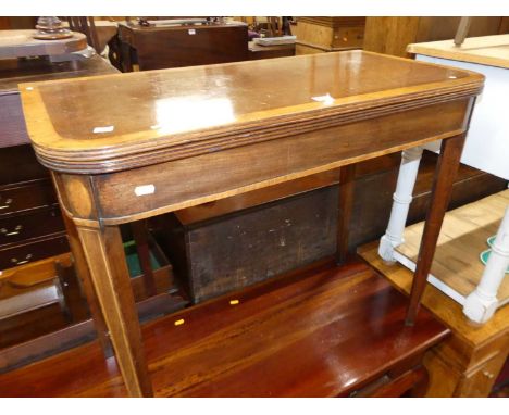 A 19th century mahogany and satinwood cross banded round cornered fold over tea table, having rear hinged gate leg action, wi