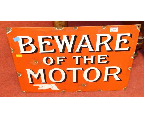 An enamel on metal wall sign titled Beware of the Motor, 37 x 52.5cm
