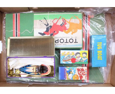 A collection of vintage children's games comprising a boxed Totopoly board game, and 4 tinplate boats