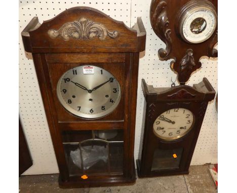 Two 1930s oak drop trunk wall clocks