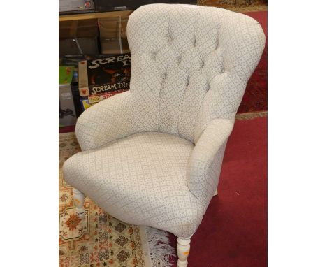 A contemporary fabric button back upholstered nursing chair, raised on painted turned forelegs, w.63cm 
