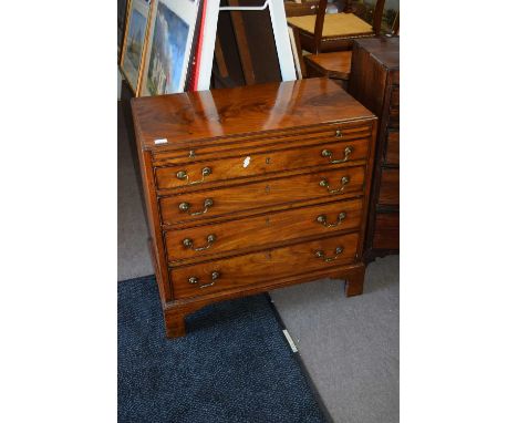 George III mahogany bachelor's chest with pull out brushing slide over four graduated drawers raised on bracket feet, 82cm wi