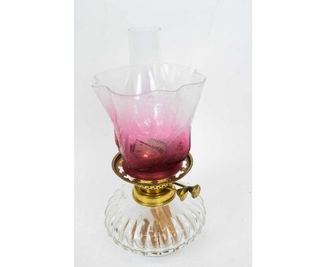 Small Victorian glass oil lamp with cranberry shade, floral design
