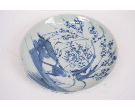 A Chinese porcelain plate decorated in blue and white with birds in branches possibly Jiajing22cm diameter