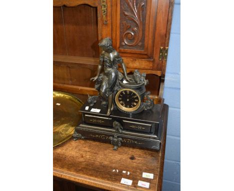 19th century mantel clock with bronzed spelter figural mount of a lady and attendant dog, raised on a black slate base with i