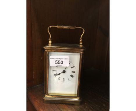 A gilt brass carriage clock, height 17cm.Ticking for a few seconds, striking action requires attention, no winding key, requi