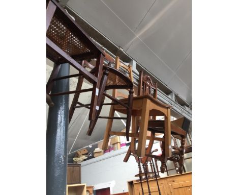 Four assorted chairs comprising a lightwood ladder back, a carved oak and two bergere seated bedroom chairs 