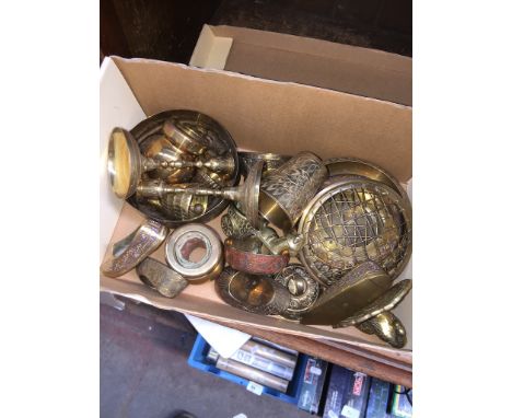 A collection of brass to include candlestick holders, cups, etc. 