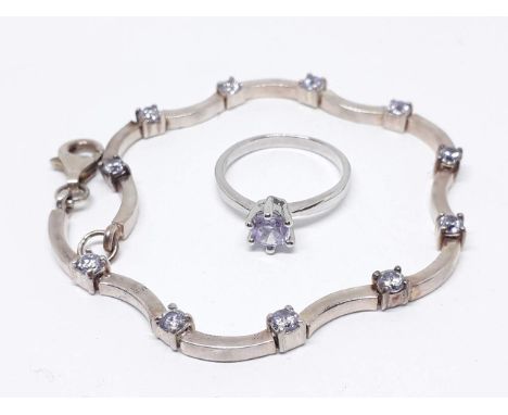 A bracelet set with purple stones, marked '925', length 17cm, with similar ring, size J. 