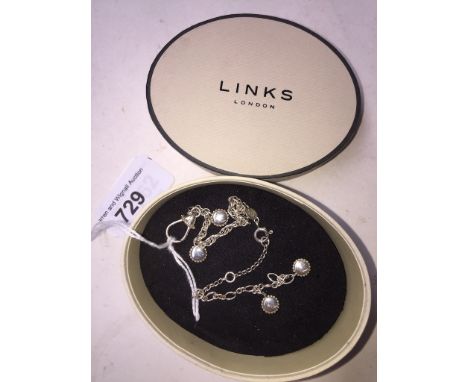 A Links of London silver charm bracelet, length 20cm, with box. 