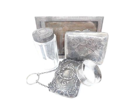 Assorted hallmarked silver comprising a photograph frame height 13cm, an embossed purse, serviette ring, a cigarette case and