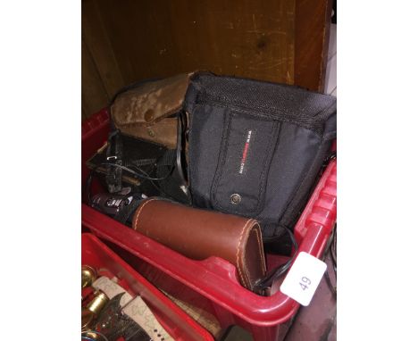 A box containing cameras and a digital video camera 