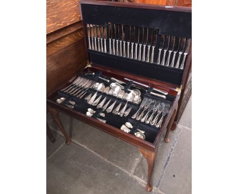 A leather topped table canteen of silver plated cutlery 