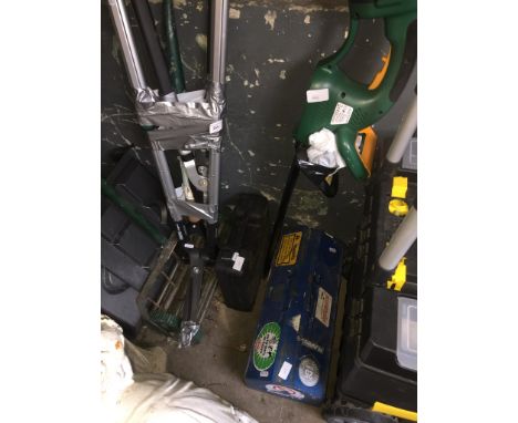 A bundle of garden tools, a hedge trimmer, a boxed drill and a tollbox with tools 