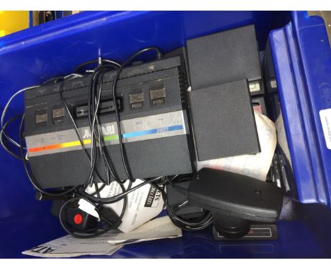 A vintage Atari 2600 console with various cassette games, 2 joysticks, accessories and charger. 