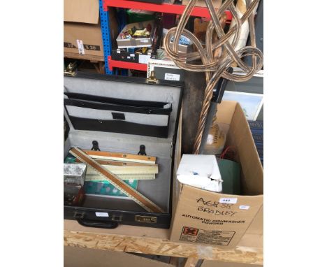 A box of misc items to include stoneware bottle, carpet beater, battery charge, letterbox, wood saws, a print and a briefcase