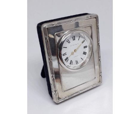 A hallmarked silver mounted desk clock, length 6.5cm. 