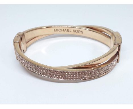 A Michael Kors gold plated bangle, diam. approx. 60mm. 