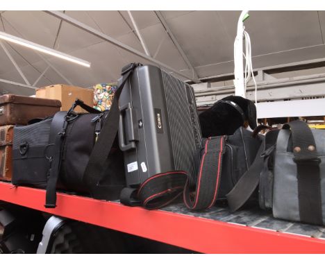 4 camera / gadget bags and a Canon hard case. 