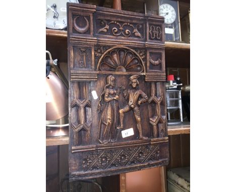 A repro carved oak panel depicting a dancing couple - after the 16th century Percy panels of York museum. 
