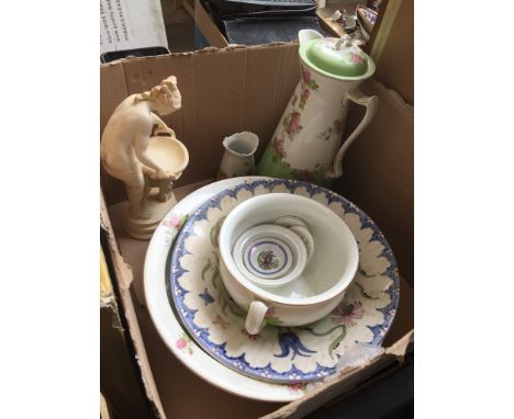 A box containing a large jug and basin set, matching chamber pot, another basin, a composite figurine, and some pin dishes et