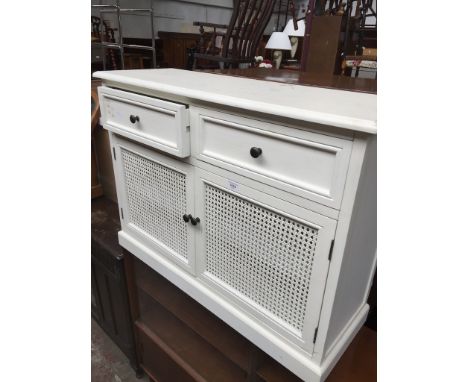 A modern small sideboard with cane panel doors 