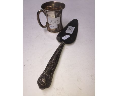 Small silver cup and a silver handled cake slice 
