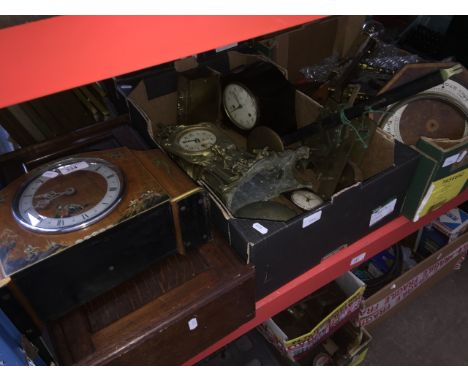 2 boxes of clocks and parts and a wall clock and a mantel clock. 