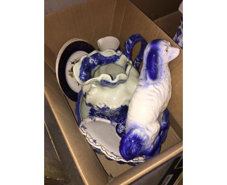 A box of mainly blue and white pottery including large jug and bowl, ceramic spaniel etc 