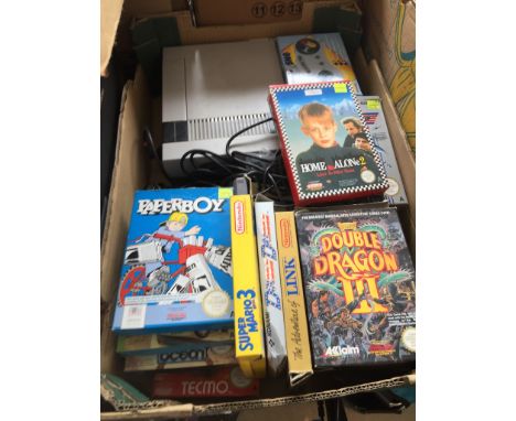 A Nintendo NESE001 console with controllers, various games, cables, etc.