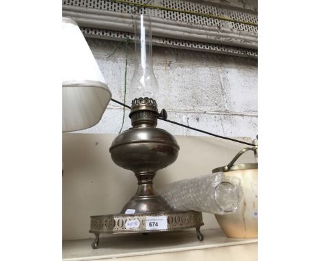 A parriffin lamp with spare funnel and a silver plated tray 