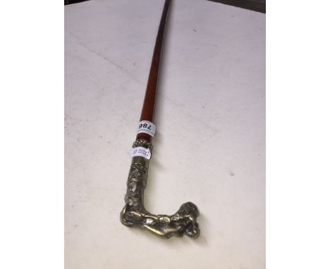 An early 20th century swagger stick with nude figure metal mount/handle 