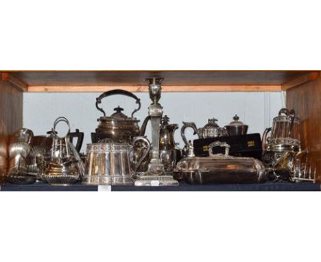 A large quantity of assorted silver plated wares, including Adam's revival plated candle stick, entree dish, spirit kettle, t