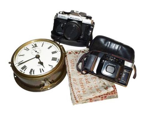 A Smith Empire brass ships bulkhead timepiece, 19th century, an unframed sampler by Elizabeth Butt, camera etc