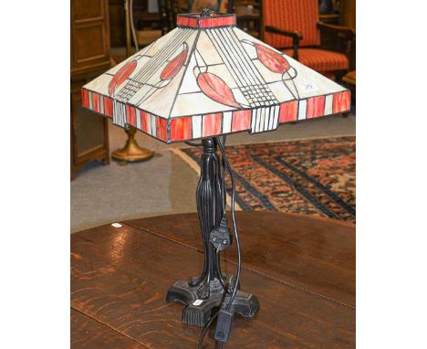 A modern Art Deco style table lamp with mosaic glass shade 