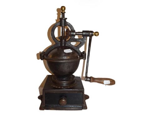 A late 19th/early 20th century coffee grinder 'Goldenberg Garrantie', 40cm high.  Mechanism in working order, handle split, s