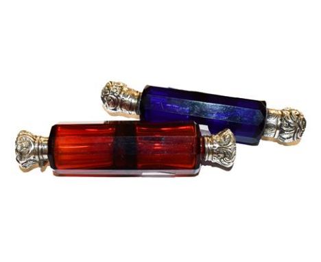 A ruby glass double ended scent bottle together with a blue glass example (2).  Blue bottle stopper lacking, metal ends dente