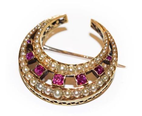 An Edwardian synthetic ruby and split pearl crescent brooch, seven graduated round cut synthetic rubies within two rows of gr