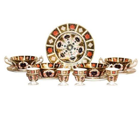 ~A set of four Royal Crown Derby Imari twin handled soup bowls and saucers a similar bowl and four matching egg cups (one tra