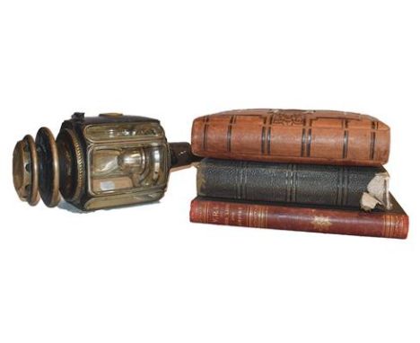 ~A 19th century carriage lantern, the burner stamped Ripon Bros Huddersfield, together with two Victorian portrait photograph