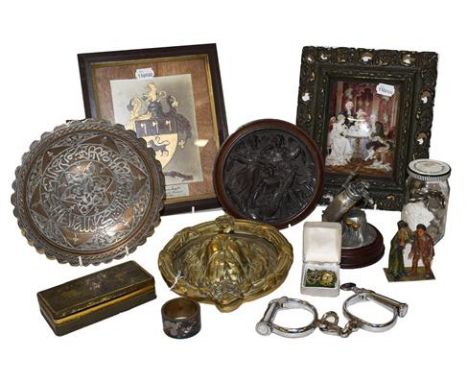 ~ A quantity of metal wares etc including a brass lion mask door knocker, Islamic silver overlay dish, Police handcuffs, vari