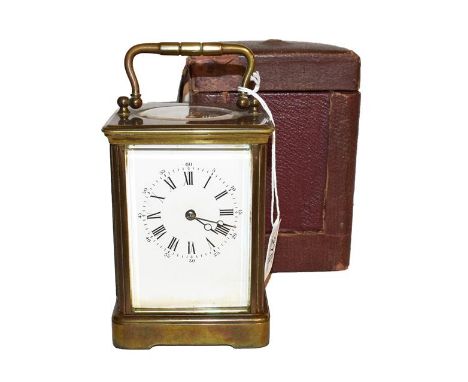 A French brass striking carriage clock with travelling case, circa 1900