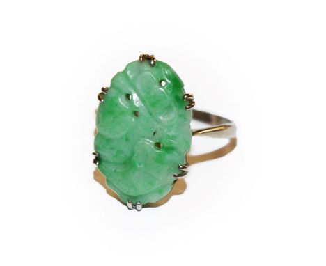 A jade ring, stamped '9CT', finger size N.  Gross weight 3.3 grams. 