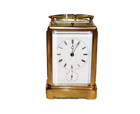 A French brass striking repeating alarm carriage clock, circa 1890, movement striking on a bell