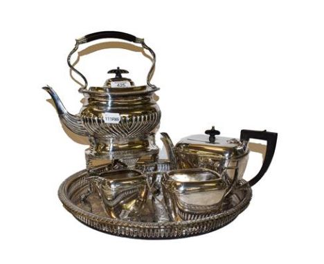 A three-piece silver plated tea service to include a plated tray and an Edwardian silver plated spirit kettle