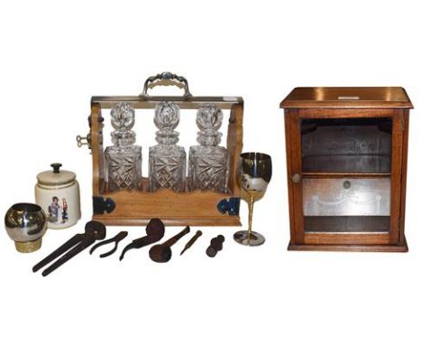 A walnut and silver plated three bottle tantalus (unmarked) together with a mahogany smokers cabinet, other smoking paraphern