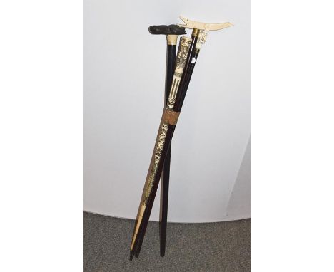 An early 20th century Japanese carved and engraved bone walking cane, carved with a Samurai and birds in a landscape, 89cm, a