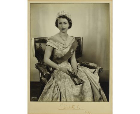 Dorothy Wilding (1893-1976) Queen Elizabeth II, a photographic portrait study, black and white, seated in formal dress, signe