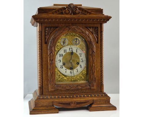 Oak cased bracket clock, the three train movement with Westminster chime, 47cm high, 37cm wide, 22cm deep, together with an o