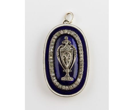 Georgian Revival pendant, central urn design, set within a border of white round paste stones, on a oval blue and white ename